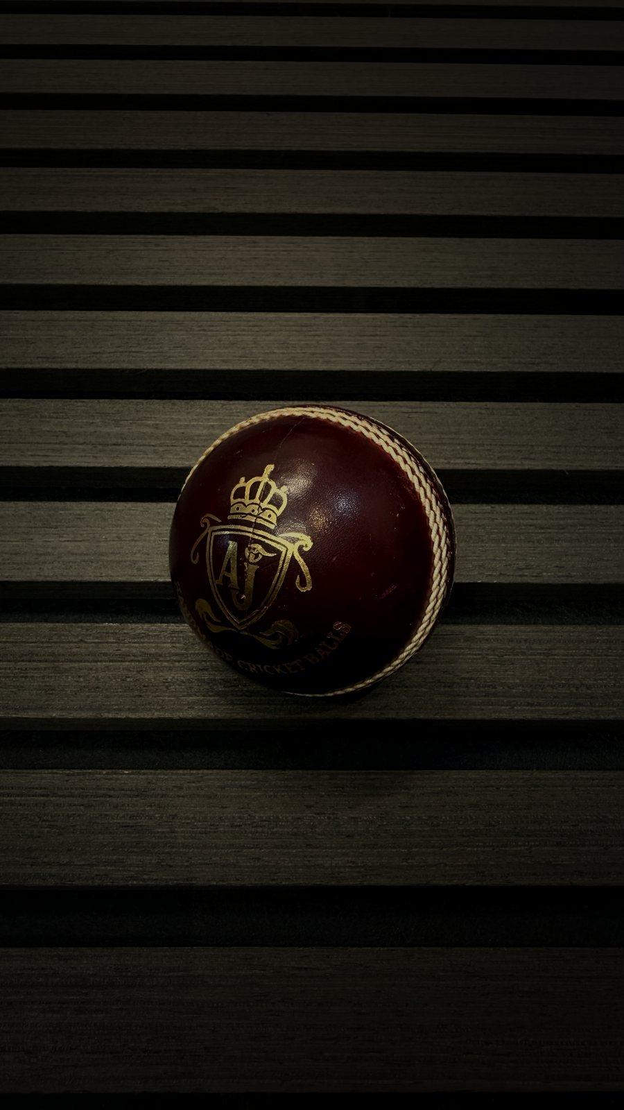 AJ Crest cricket ball in oxblood leather
